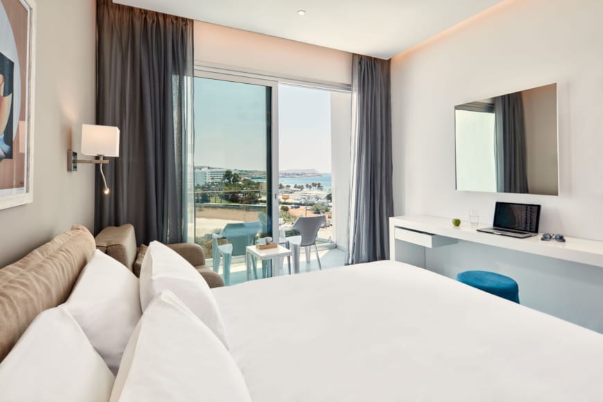 a hotel room with a large window