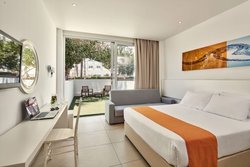 a bedroom with a large window