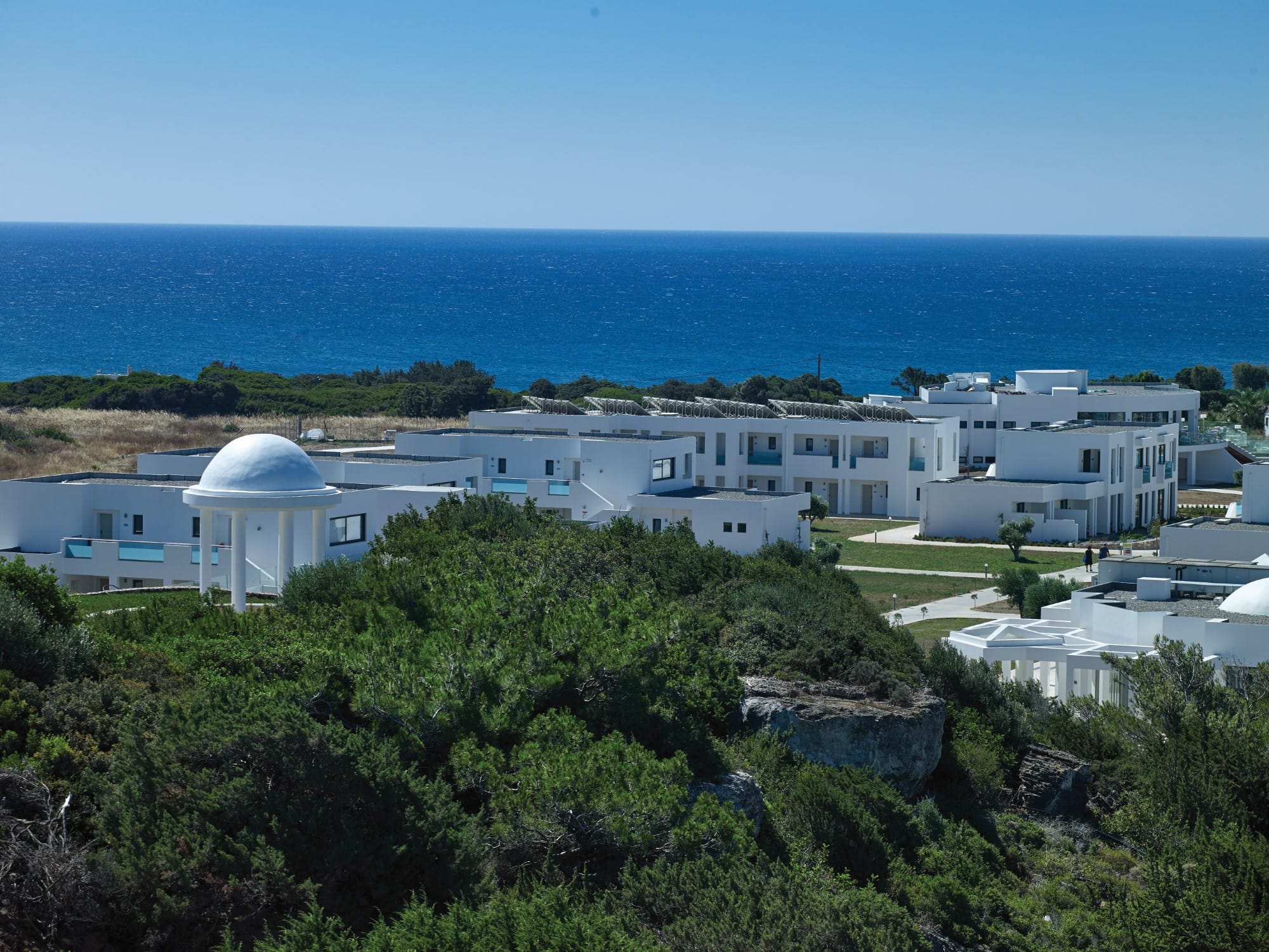 a group of buildings by the water