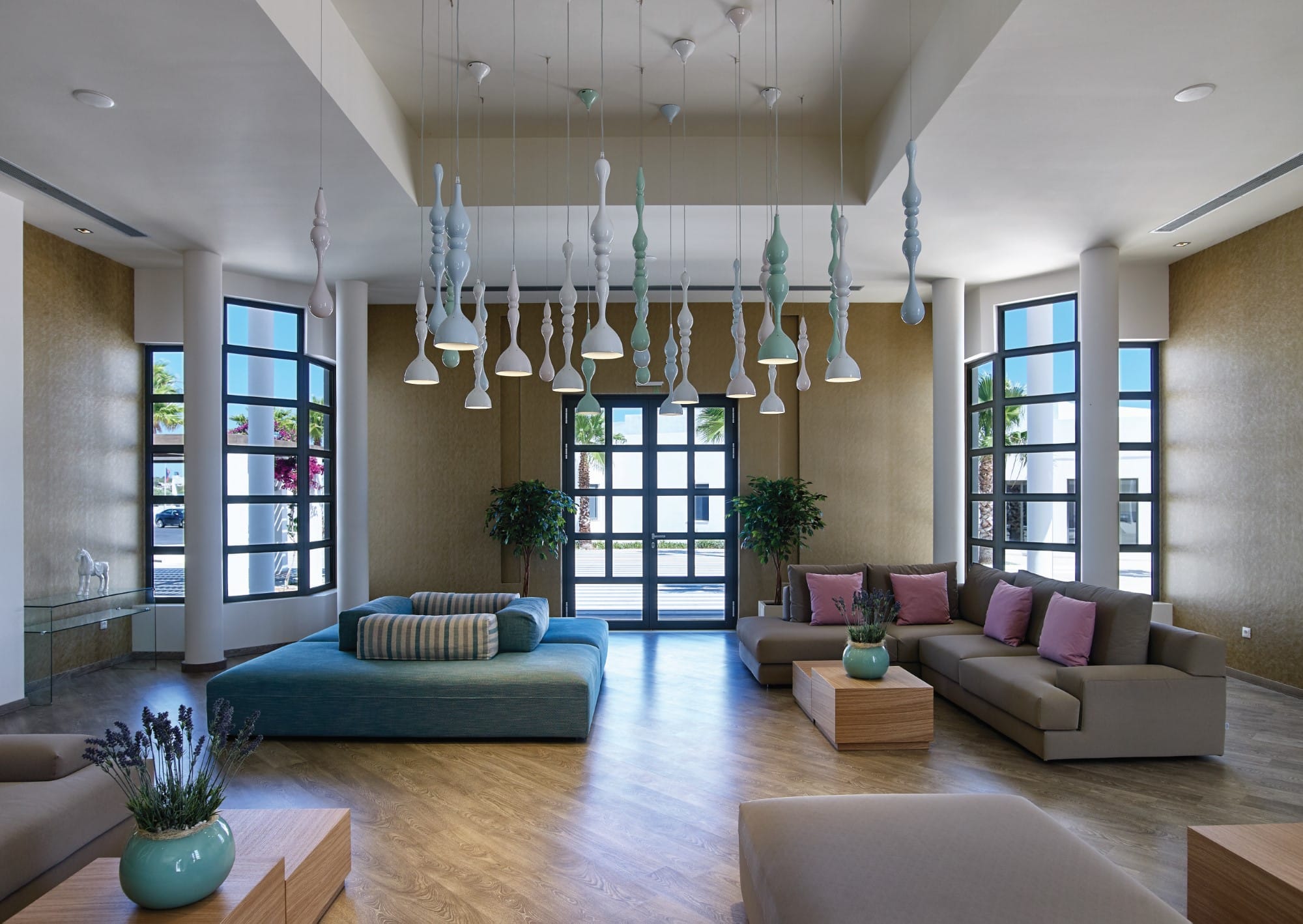 a living room with a chandelier and couches