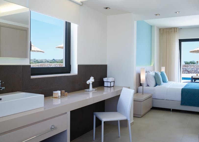 a bathroom with a bed and a sink