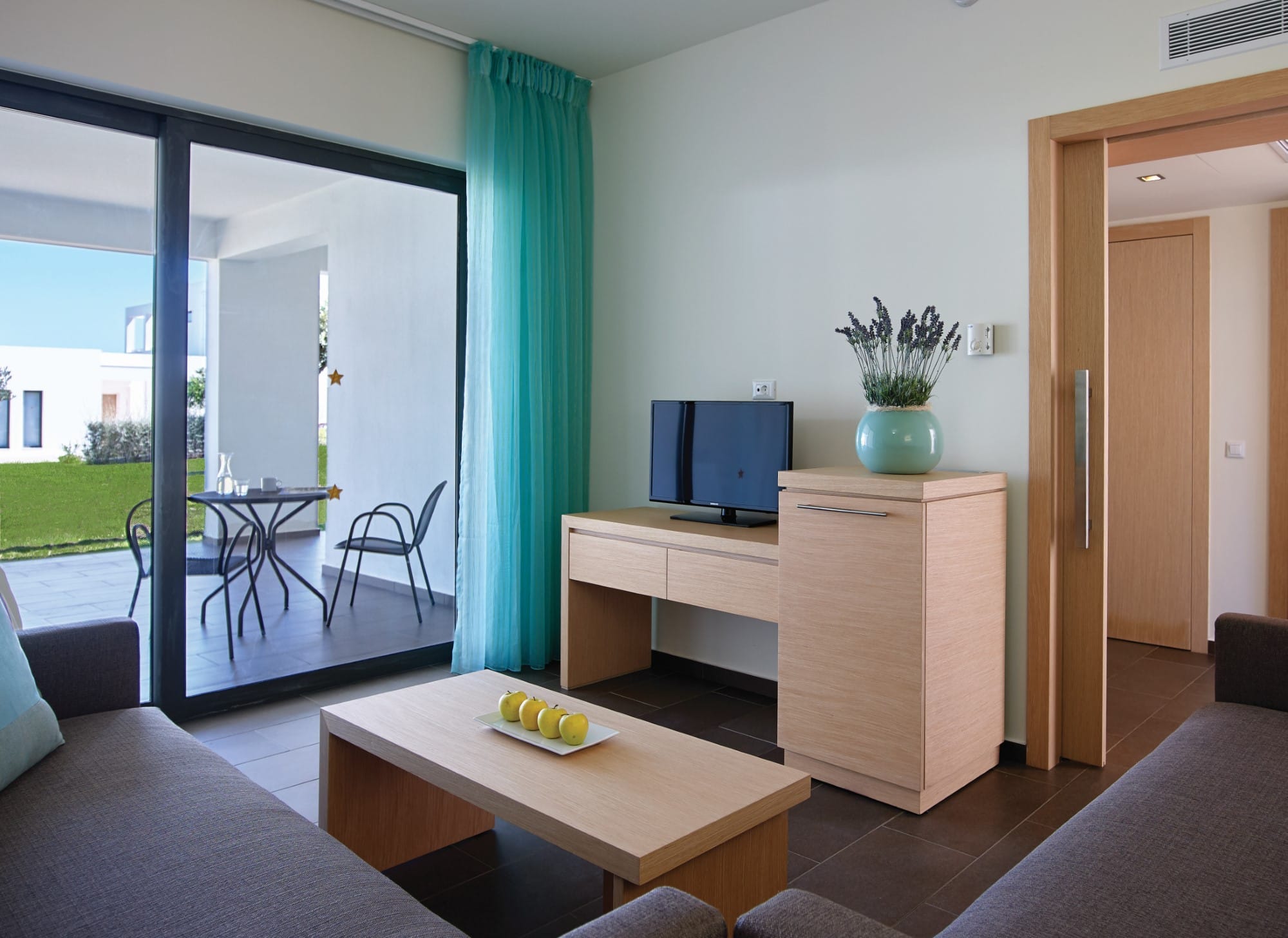 a room with a tv and a table