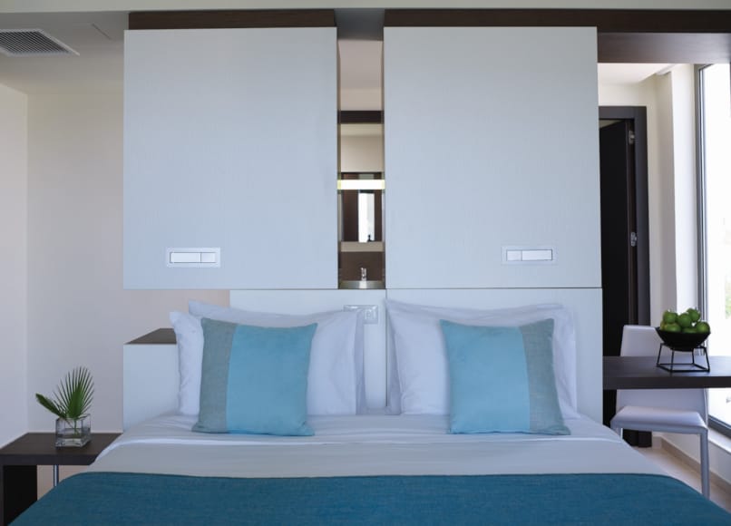 a bed with a blue cover