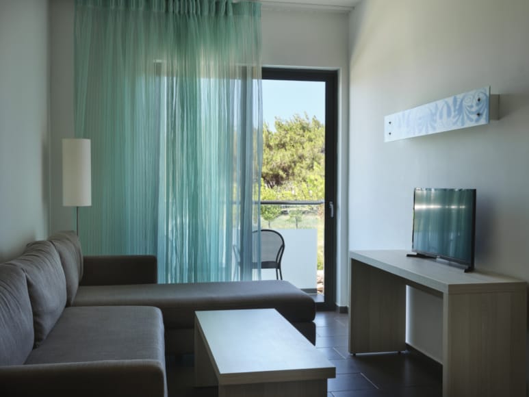 a living room with a tv and a table