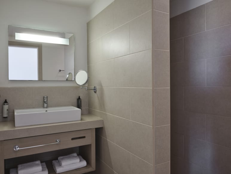 a bathroom with a mirror and sink
