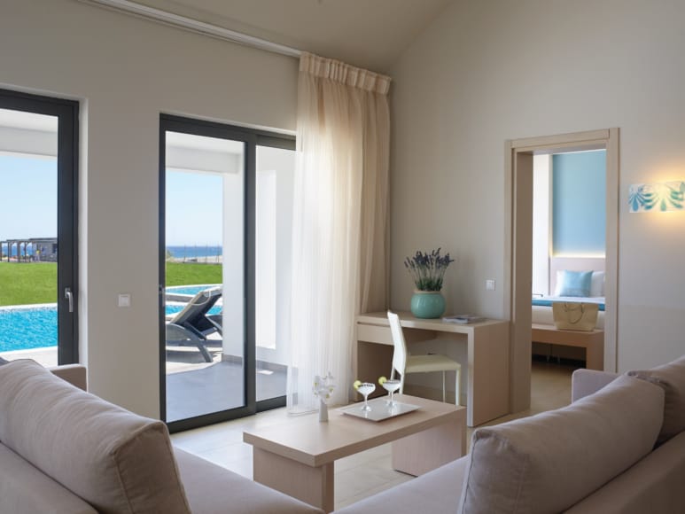 a living room with a glass door