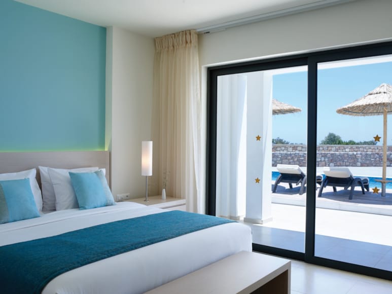 a bedroom with a large window