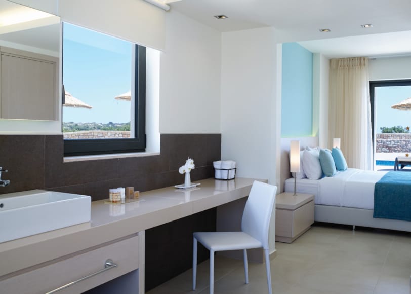 a bathroom with a bed and a sink