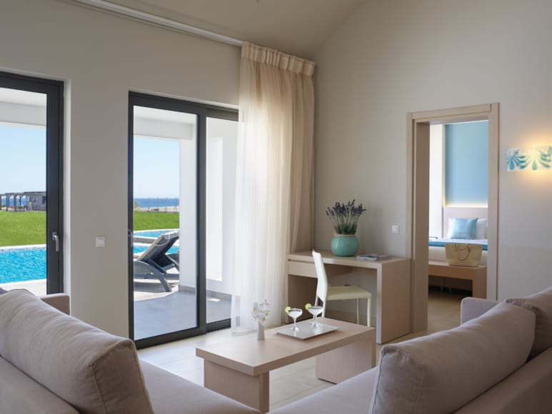 a living room with a glass door