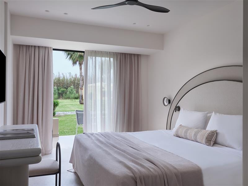 a bedroom with a large window