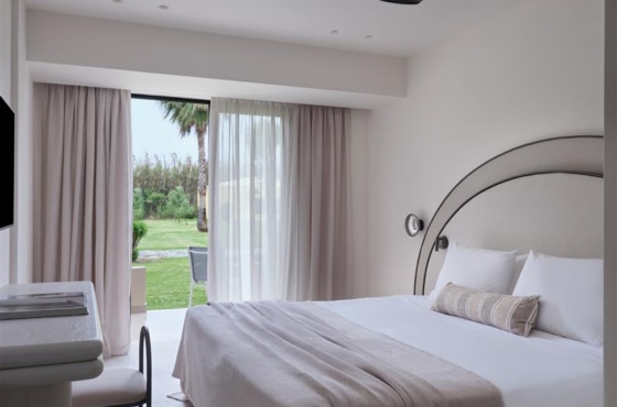 a bedroom with a large window