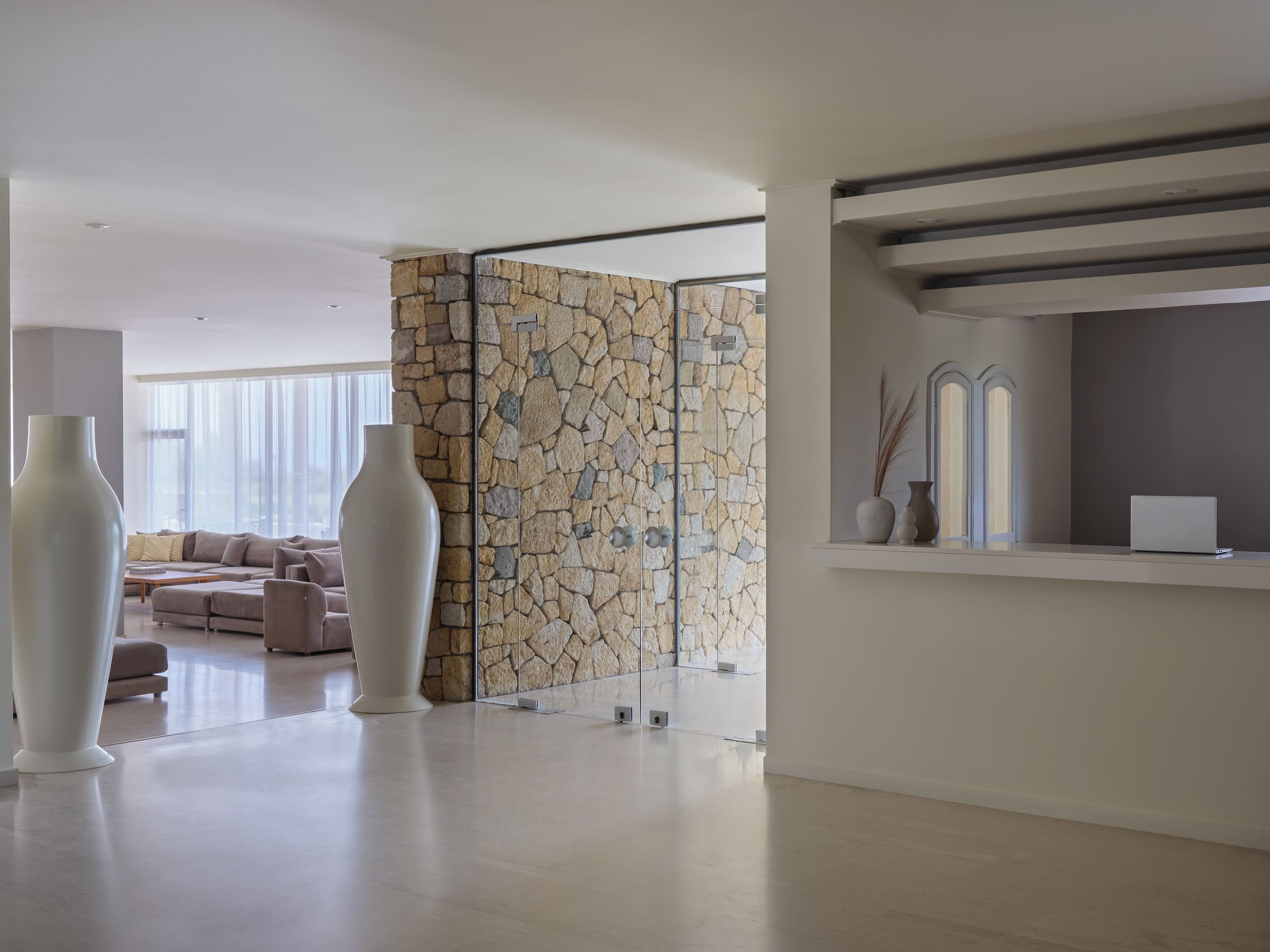 a living room with a large glass vase and a large vase