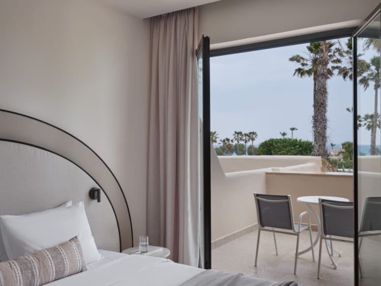 a bedroom with a large window