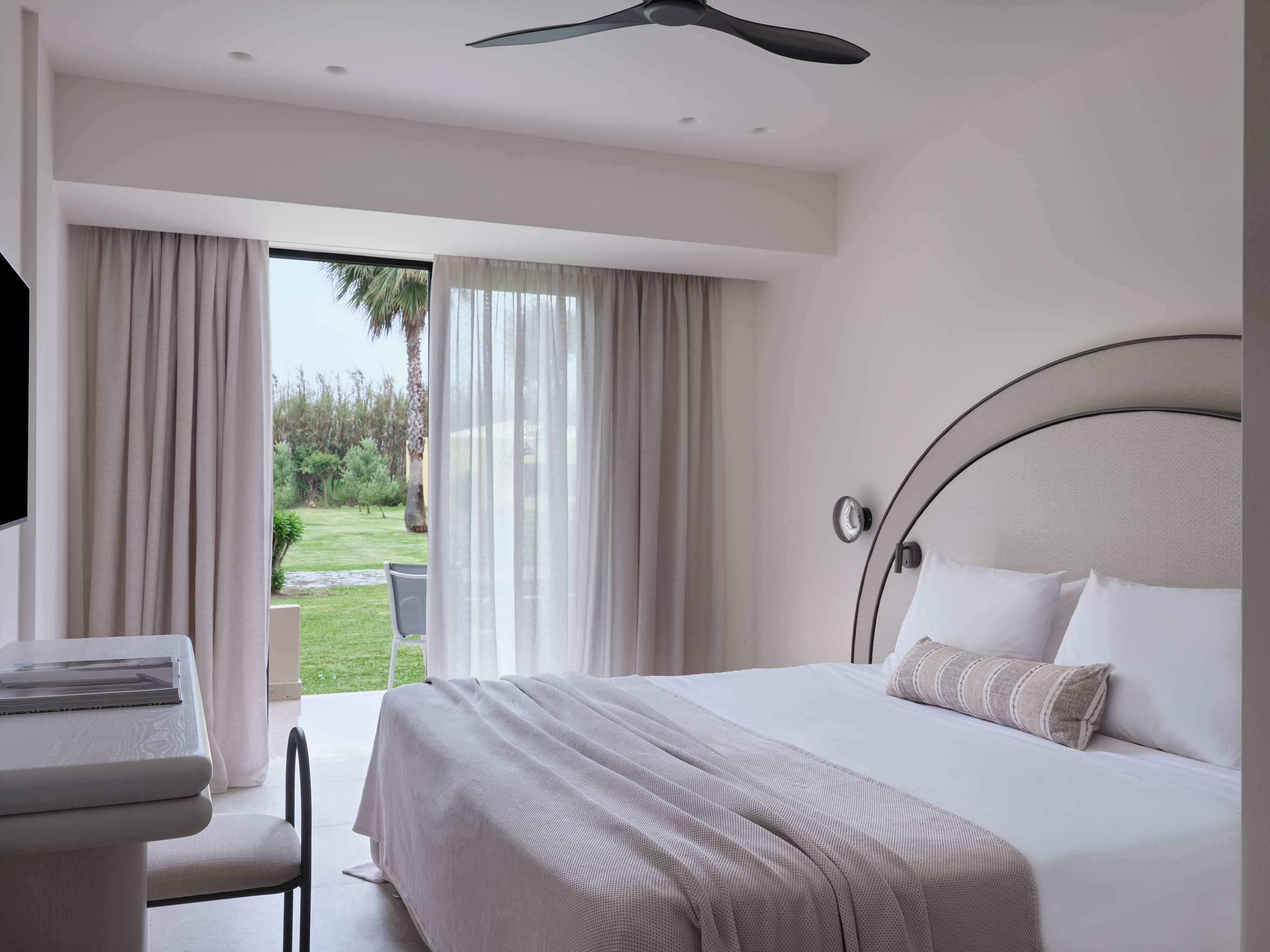 a bedroom with a large window