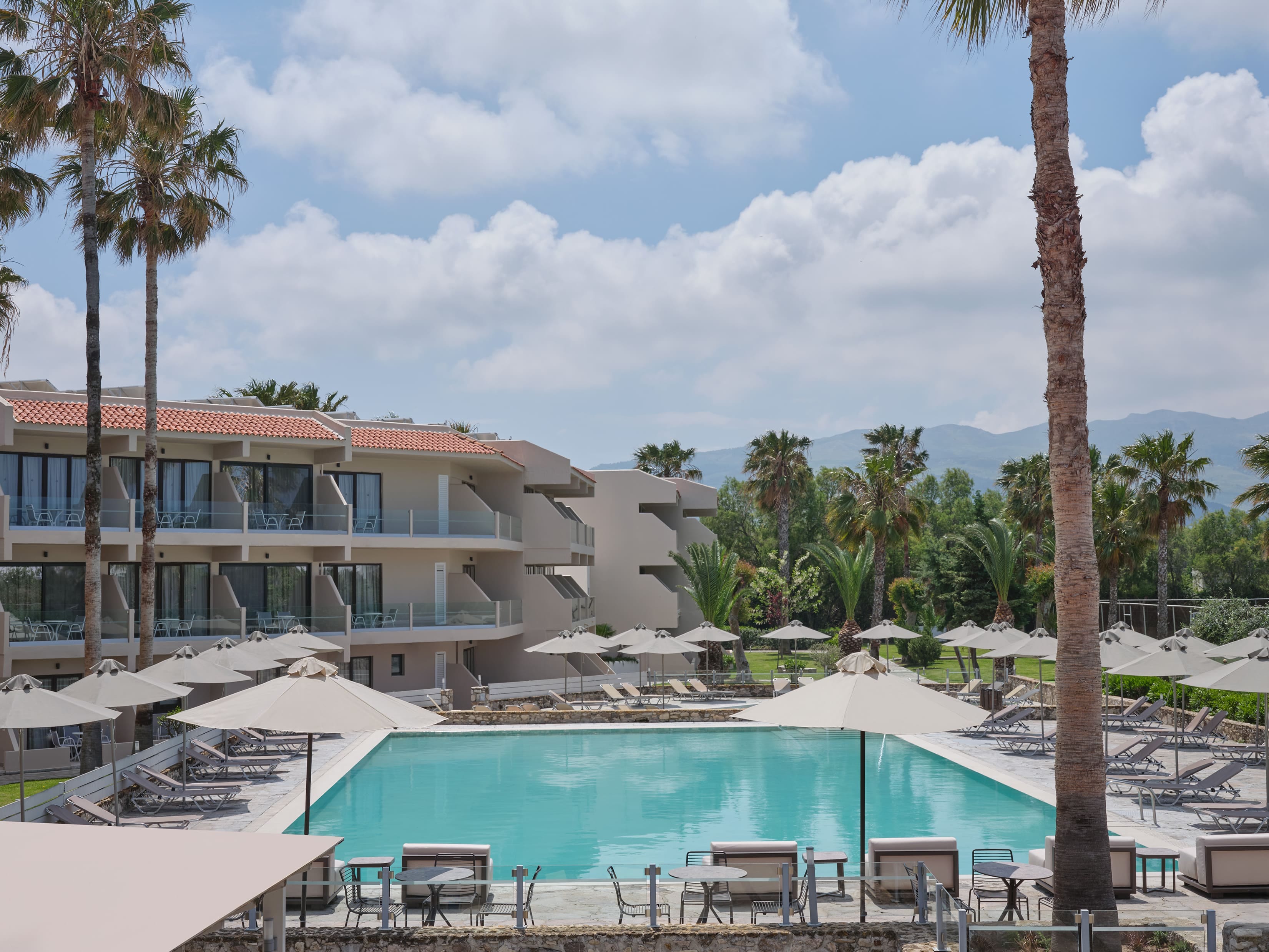 a swimming pool in front of a building