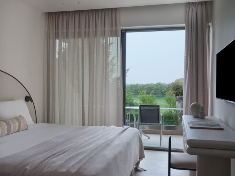 a bedroom with a large window