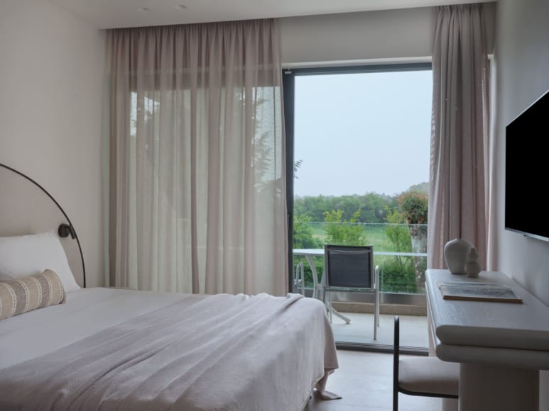 a bedroom with a large window