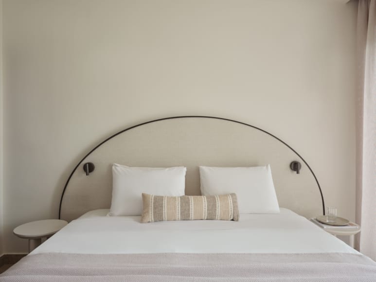a bed with a lamp on it