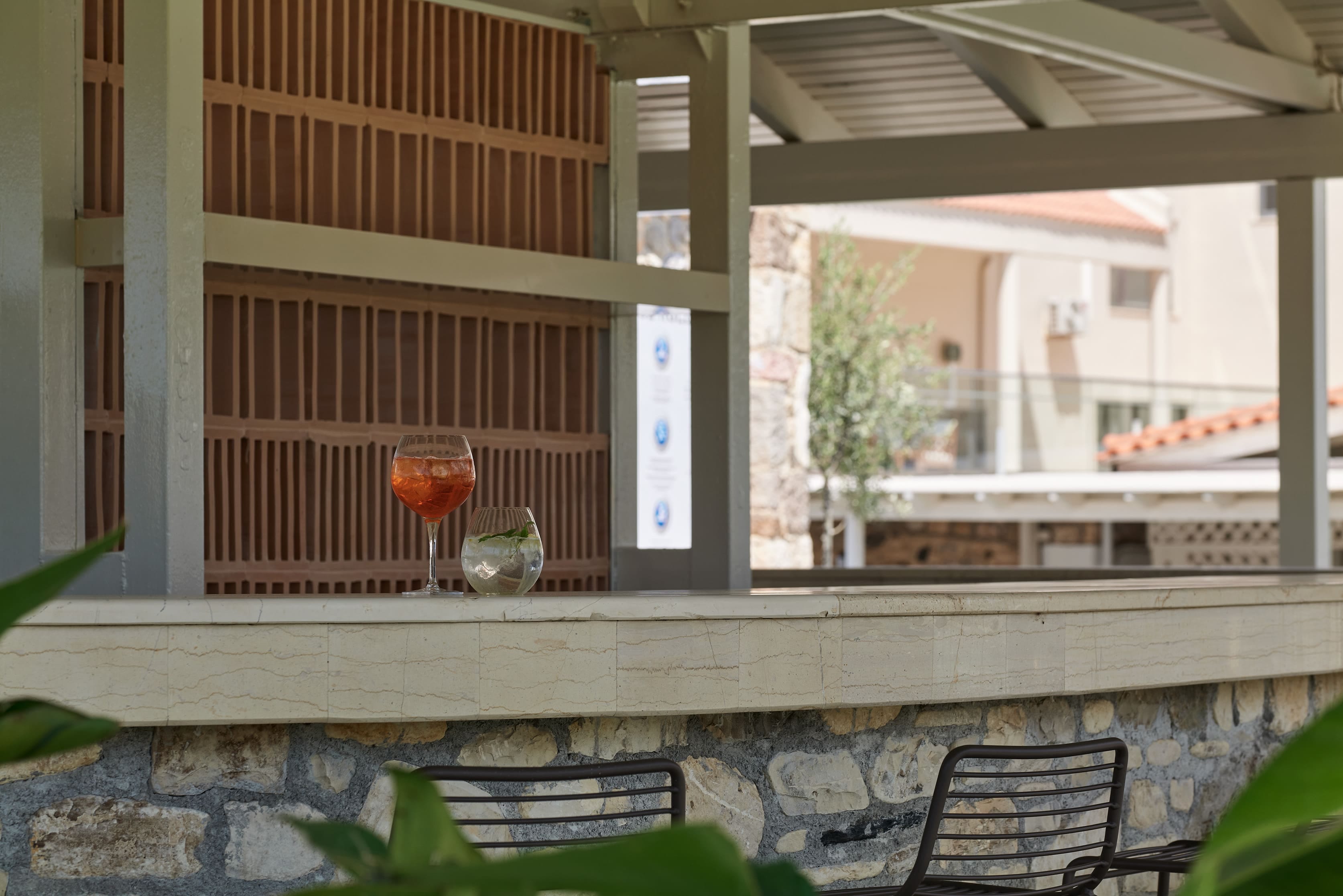 a patio with a glass of wine