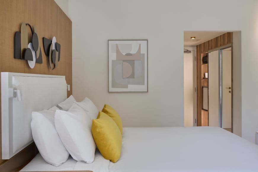 a bed with white pillows