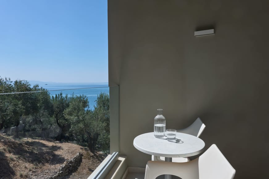 a bathroom with a view of the ocean