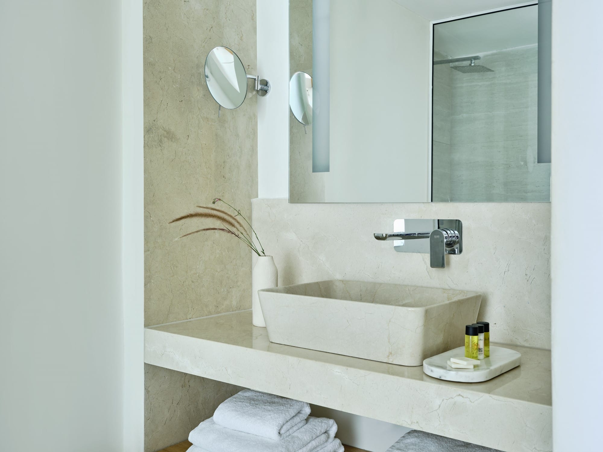 a bathroom with a sink and mirror