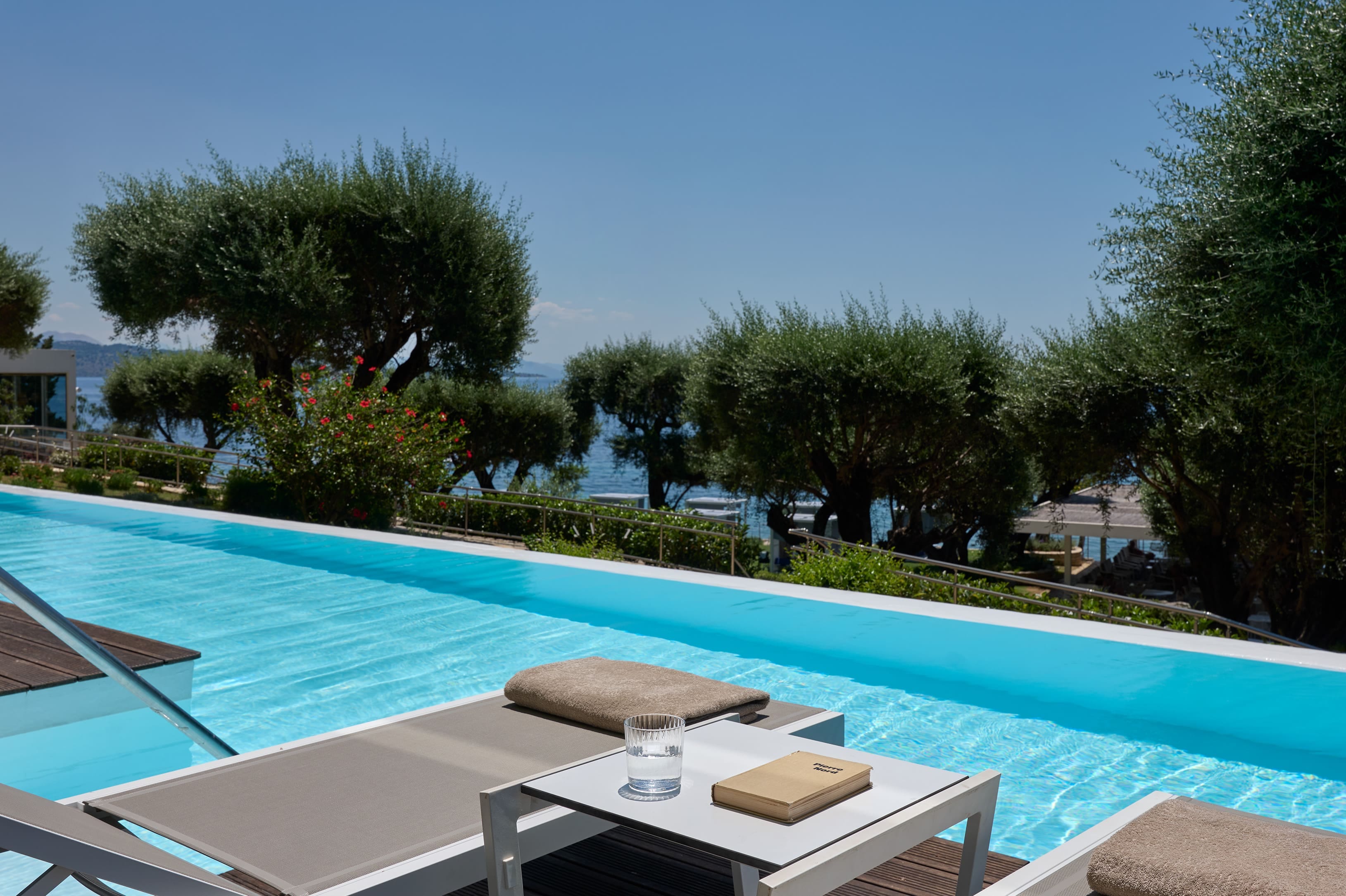 a pool with a table and chairs