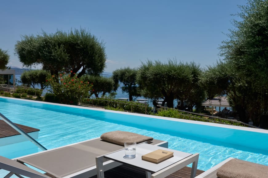 a pool with a table and chairs
