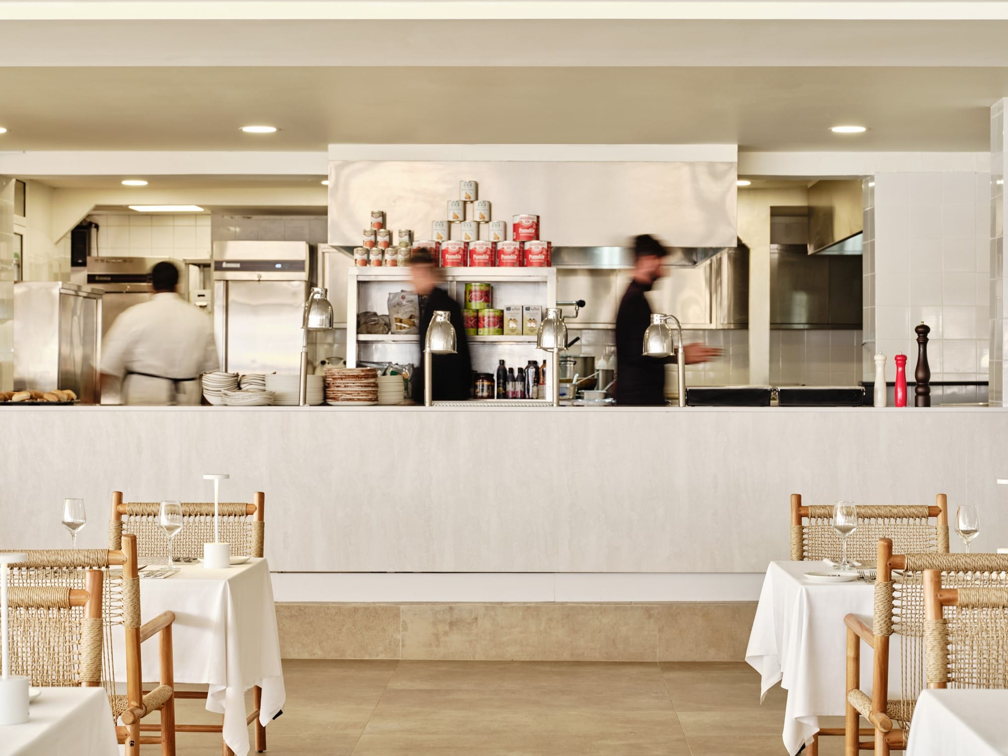 a kitchen with a couple of chefs