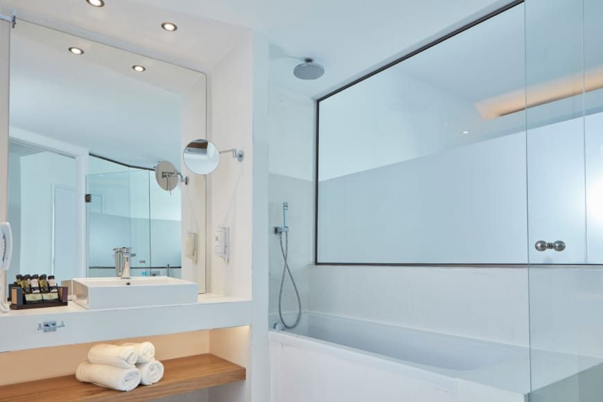 a bathroom with a tub and sink