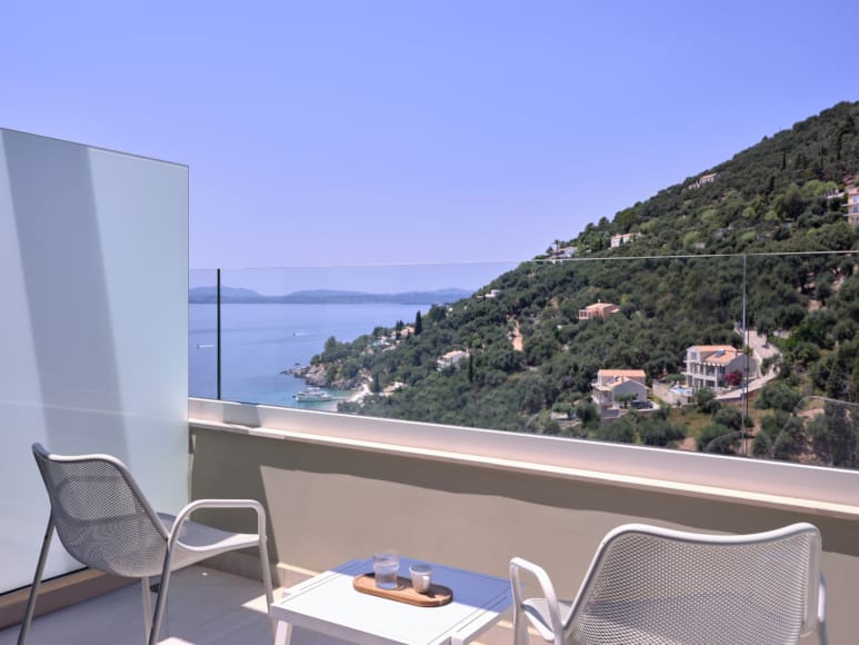 a table and chairs on a balcony