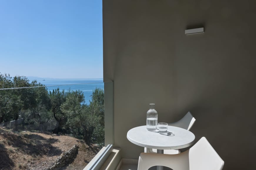 a bathroom with a view of the ocean