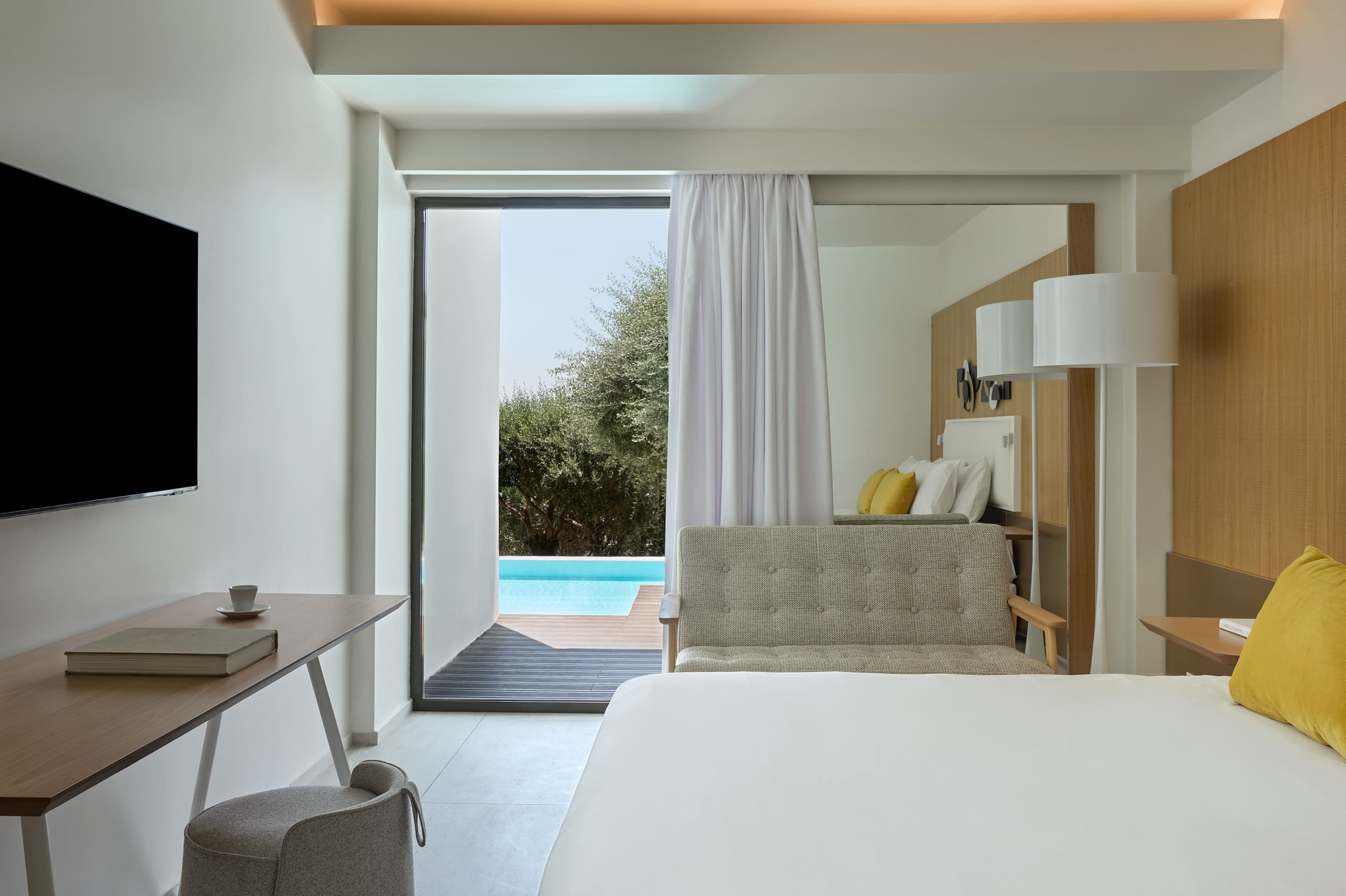 a room with a bed and a tv