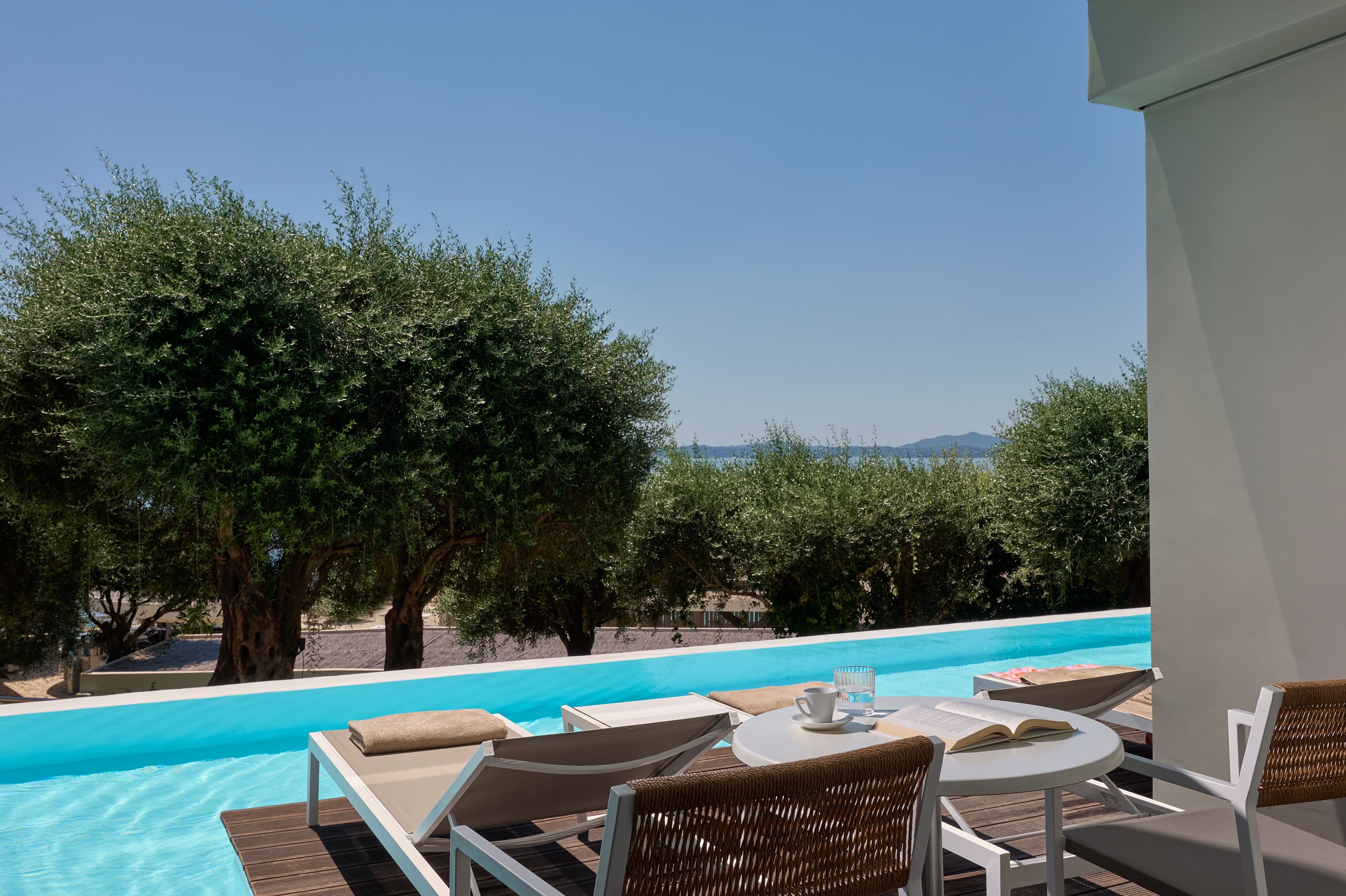 a pool with chairs around it