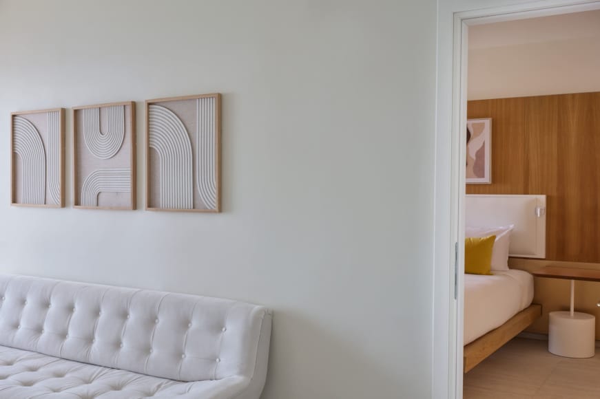 a white wall with a mirror
