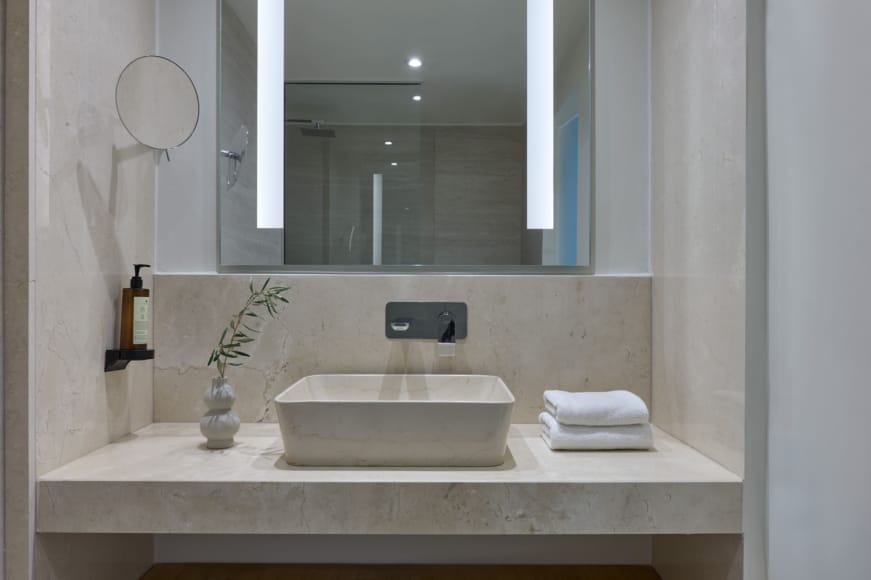 a bathroom with a large mirror