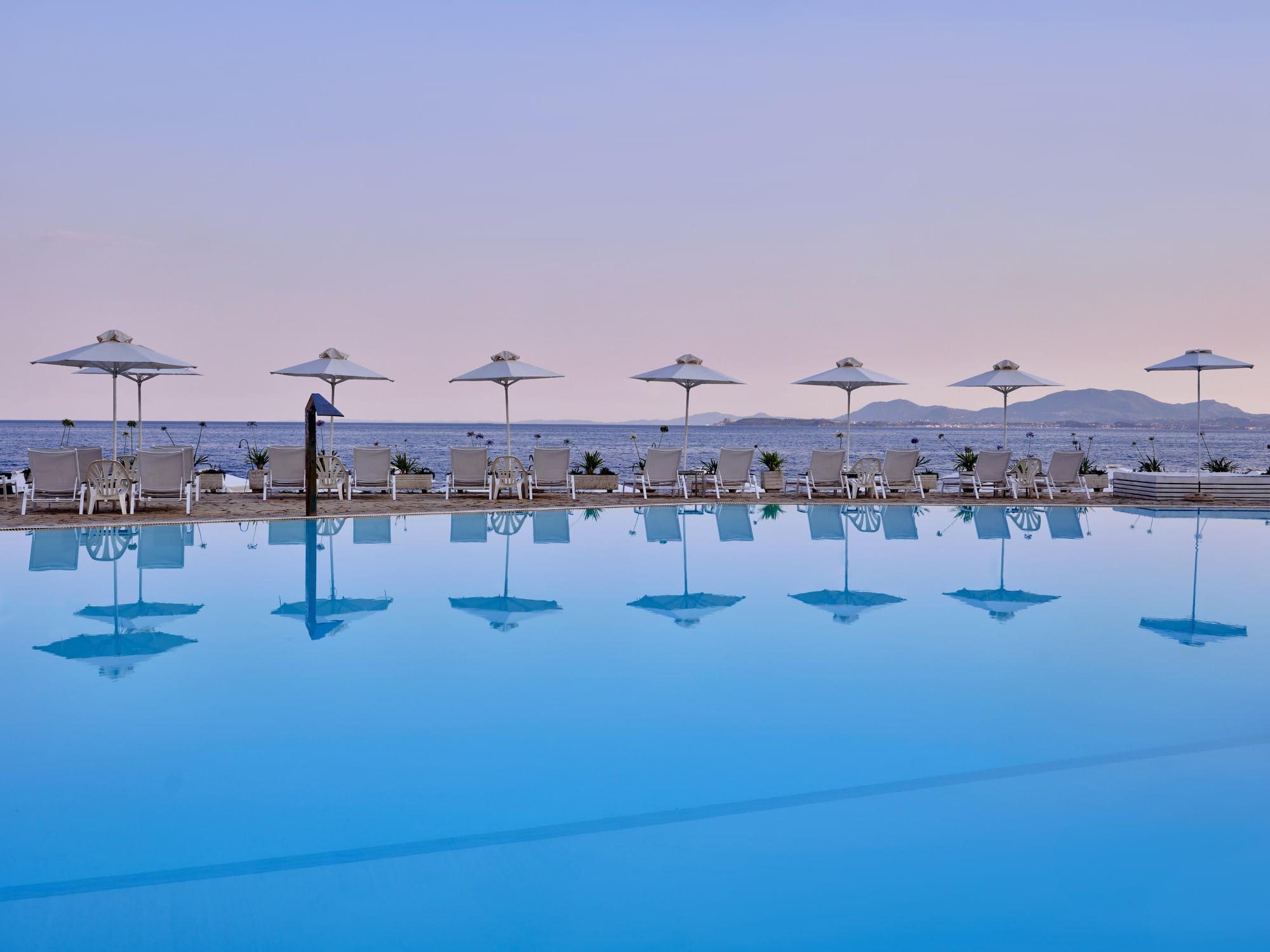 a group of umbrellas on a dock