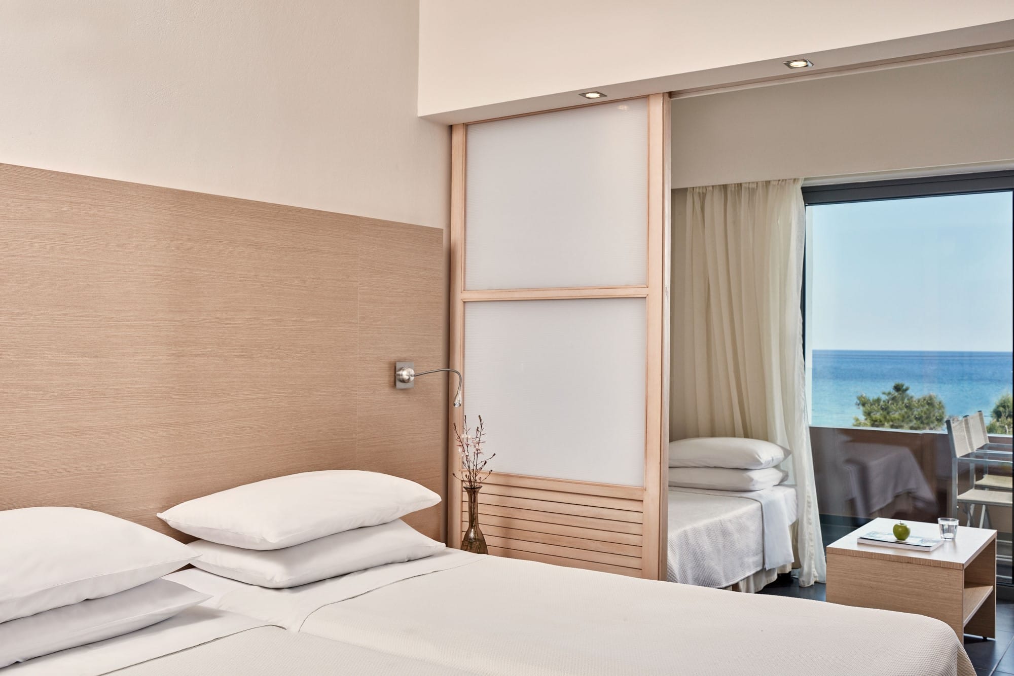 a bed with a white bed spread