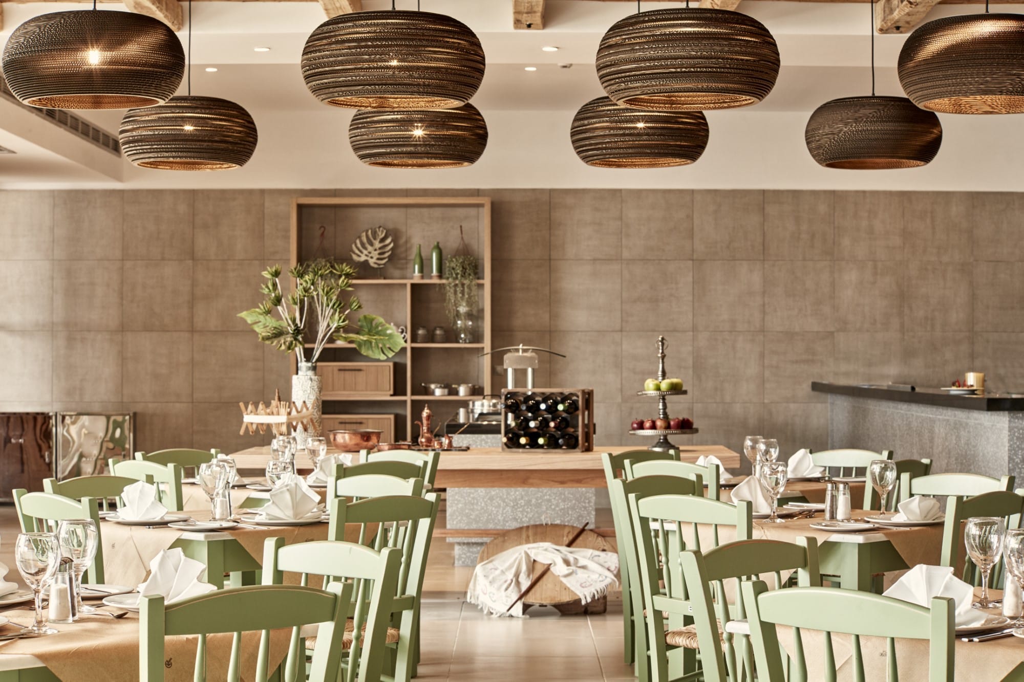 a large kitchen with tables and chairs