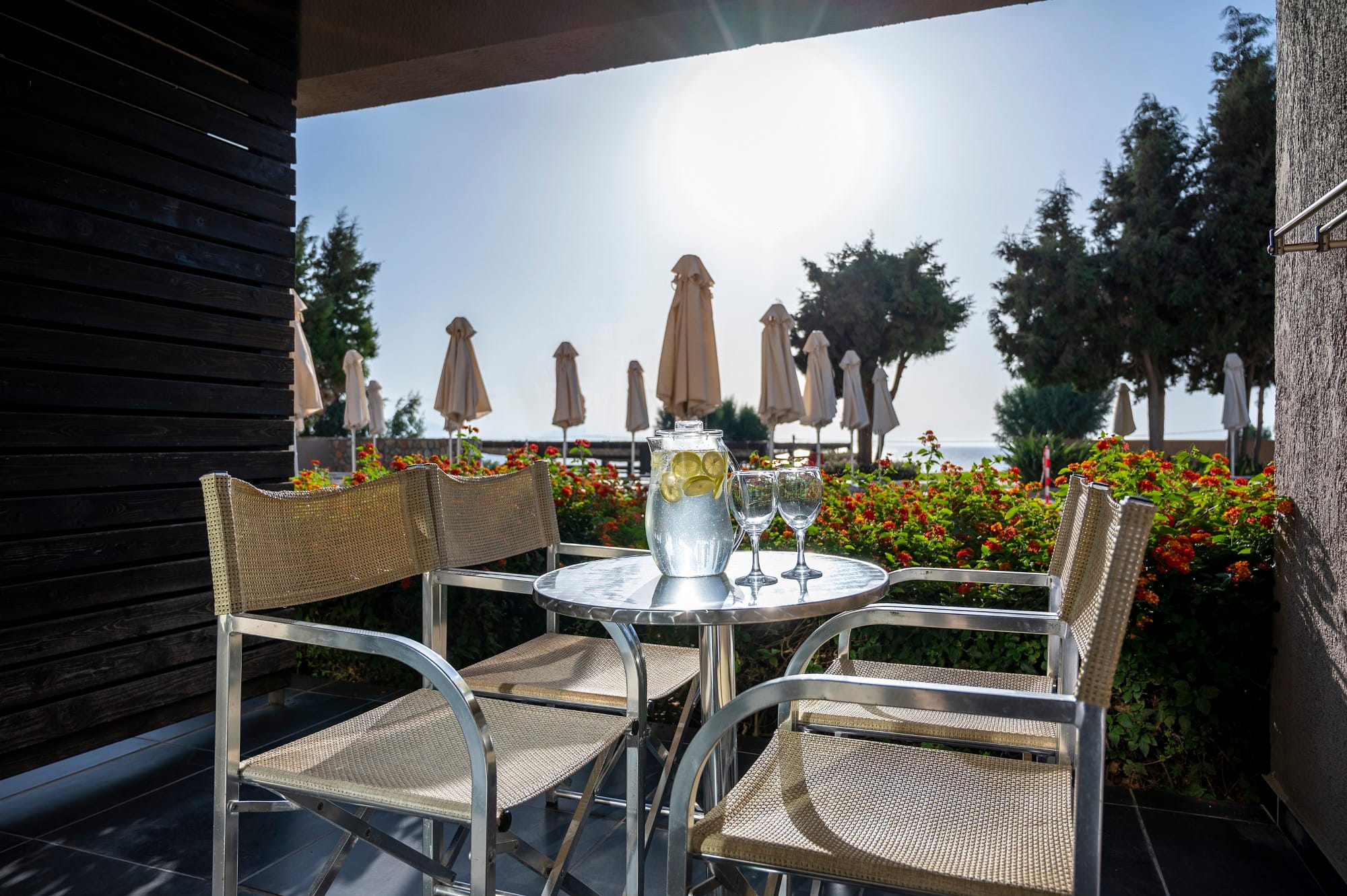 a table with chairs and umbrellas