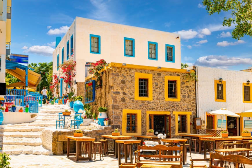 a building with tables and chairs outside