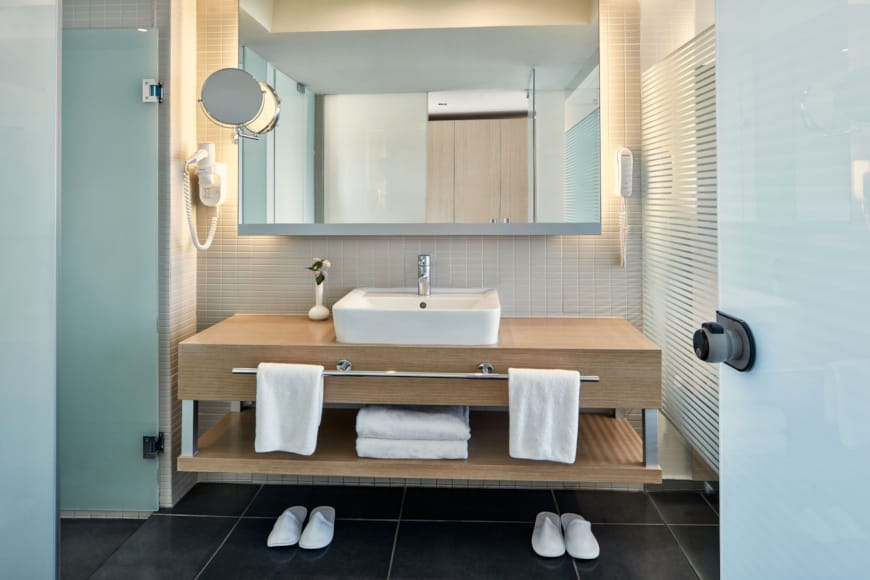 a bathroom with a sink and a mirror