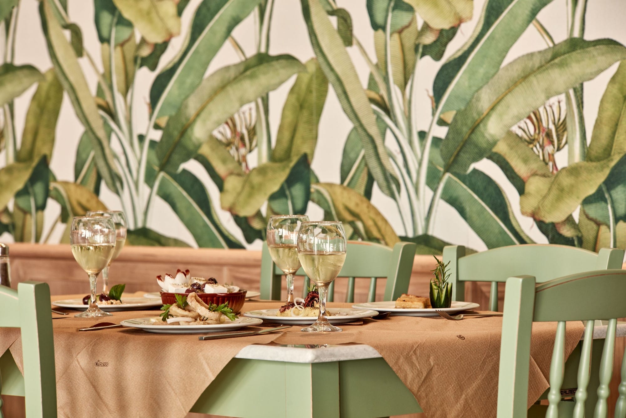 a table with glasses and plates on it