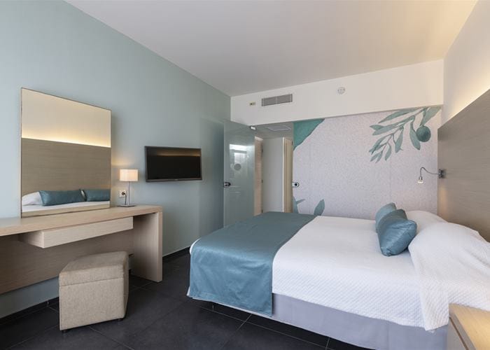 a hotel room with two beds