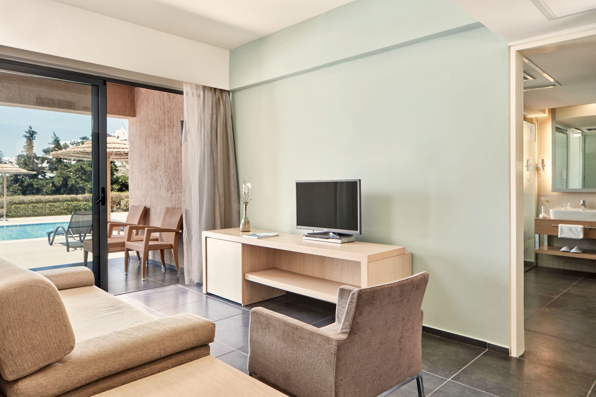 a living room with a tv and couches