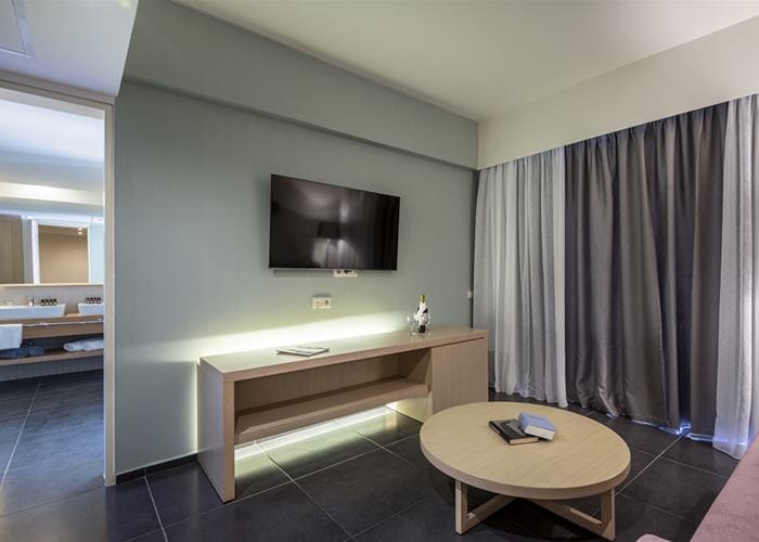 a room with a tv and a table