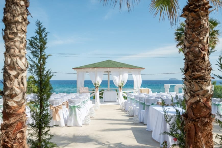 a beach with tables and chairs