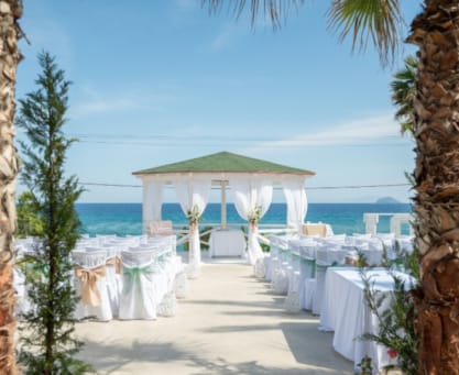 a beach with tables and chairs