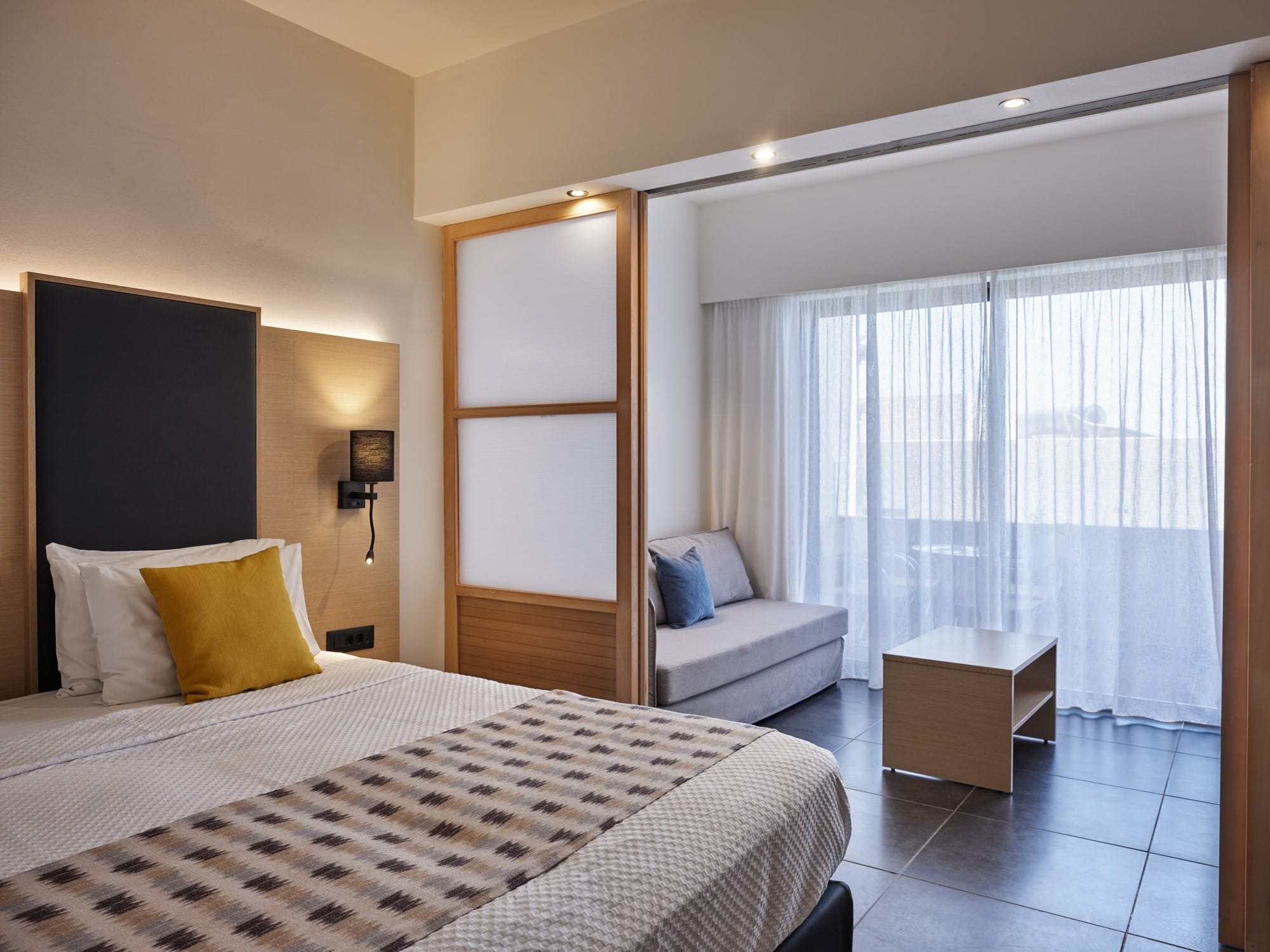 a bedroom with a bed and a chair