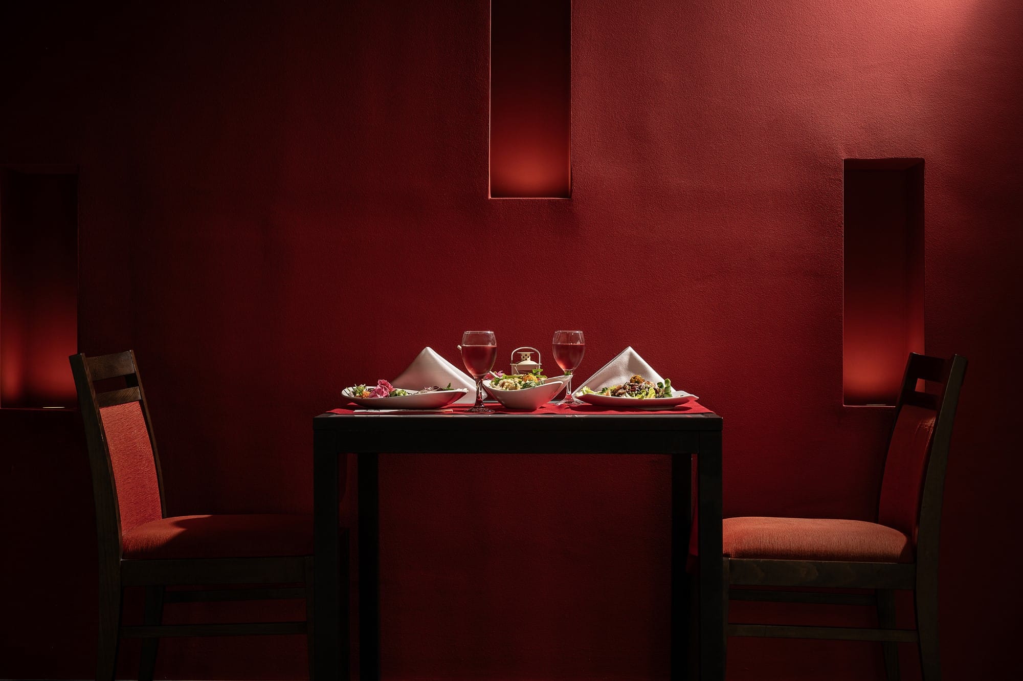 a table with glasses and plates on it